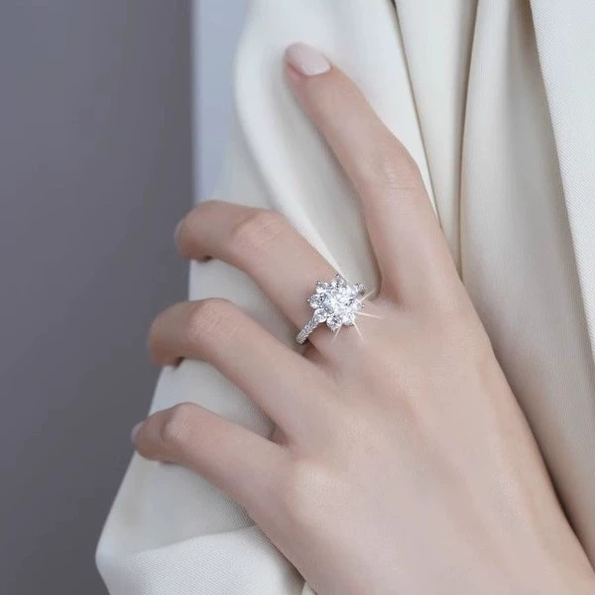 Snowflake Round Moissanite Adjustable Engagement Ring with CZ worn on hand to show scale, band width, and ring profile