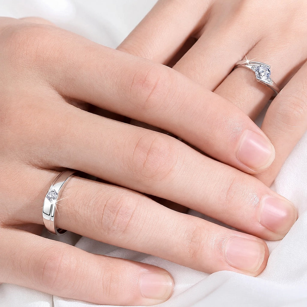 Round Moissanite Couples Wedding Rings worn on hand to show scale, band width, and ring profile