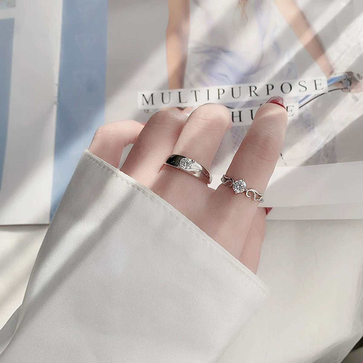 Round Moissanite Couples Wedding Rings worn on hand to show scale, band width, and ring profile
