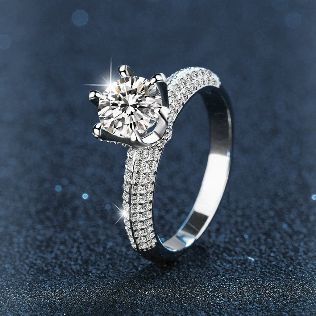 Six-Prong Round Moissanite Engagement Ring with CZ close-up detail view with moissanite sparkle