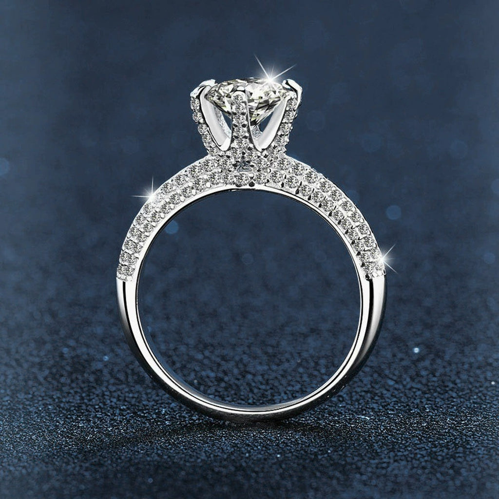 Six-Prong Round Moissanite Engagement Ring with CZ close-up detail view with moissanite sparkle