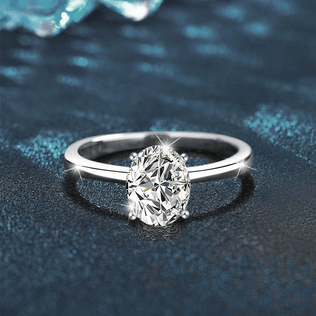 Four-Prong Oval Moissanite Solitaire Engagement Ring close-up detail view with moissanite sparkle