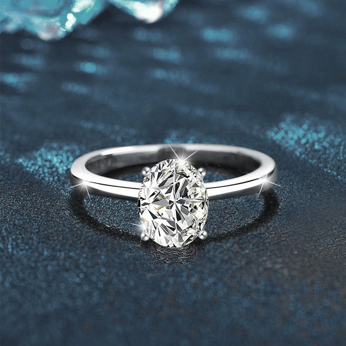 Four-Prong Oval Moissanite Solitaire Engagement Ring close-up detail view with moissanite sparkle