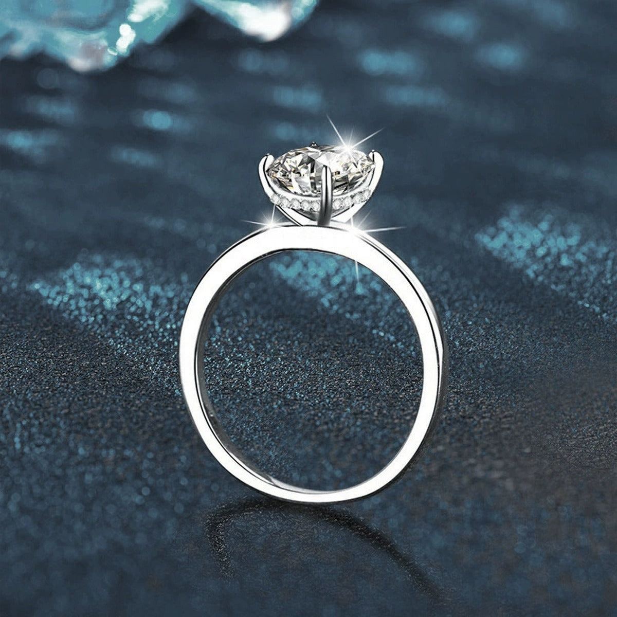 Four-Prong Oval Moissanite Solitaire Engagement Ring close-up detail view with moissanite sparkle