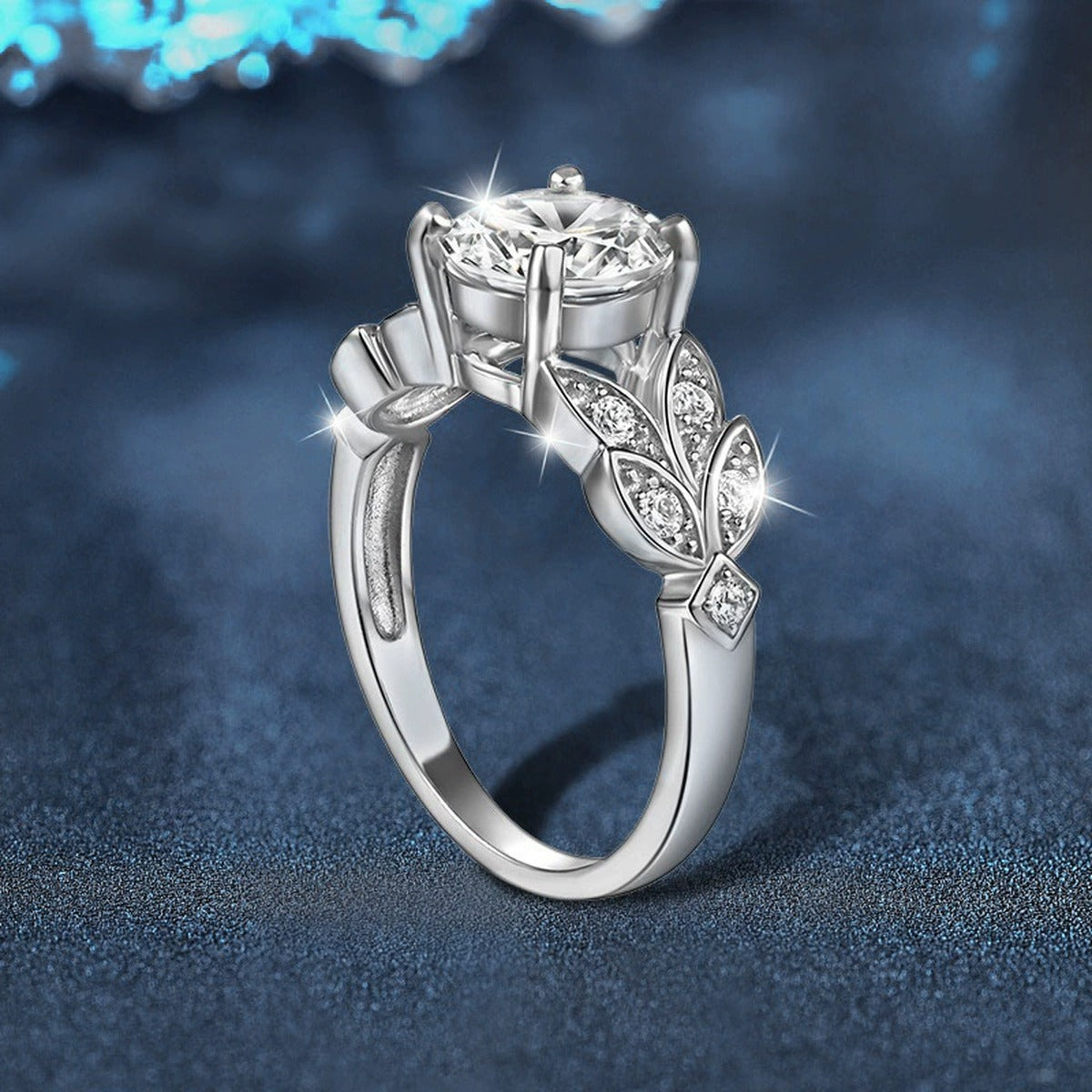 Leaf Motif Four-Prong Round Moissanite Engagement Ring with CZ close-up detail view with moissanite sparkle