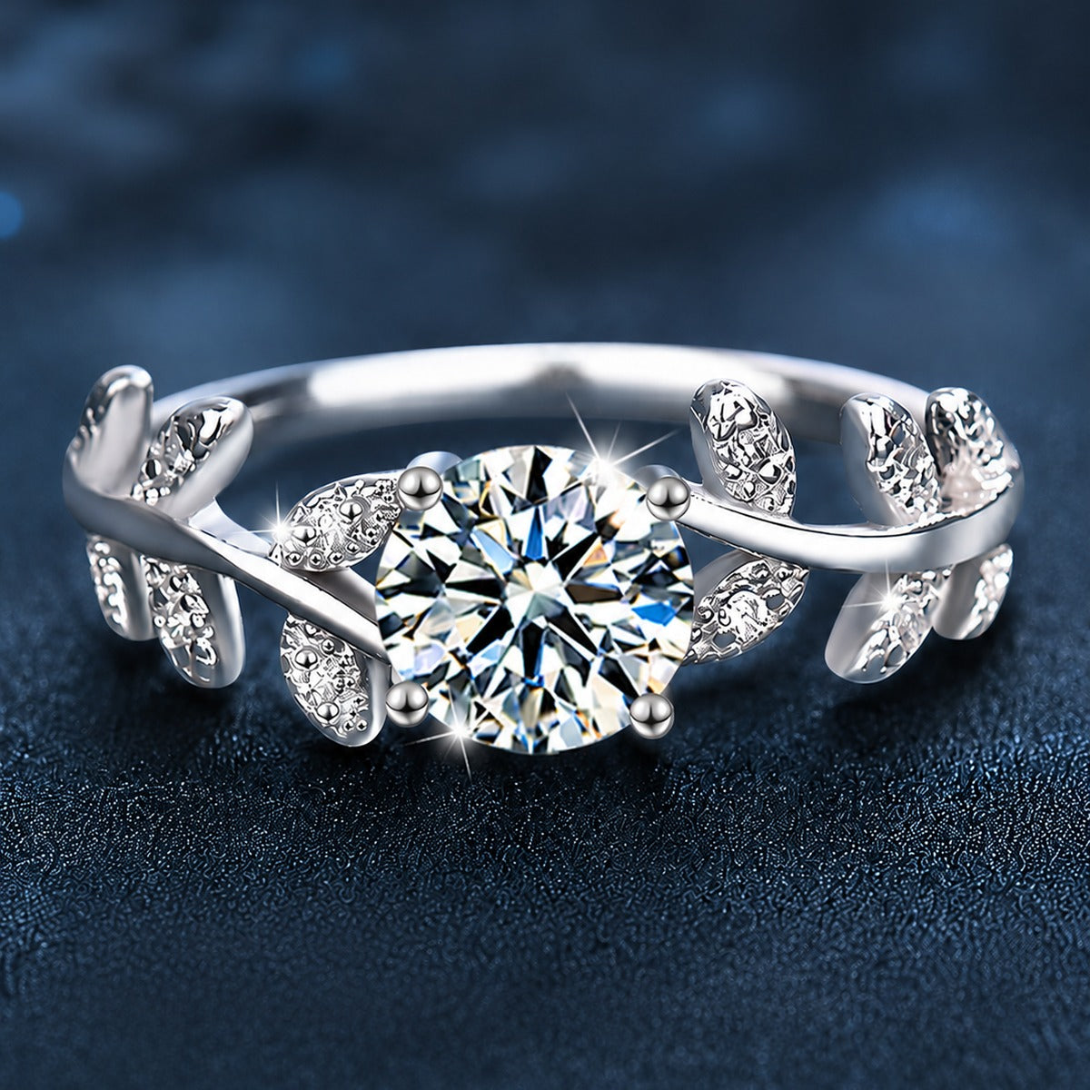 Leaf Vine Four-Prong Round Moissanite Engagement Ring with CZ close-up detail view with moissanite sparkle