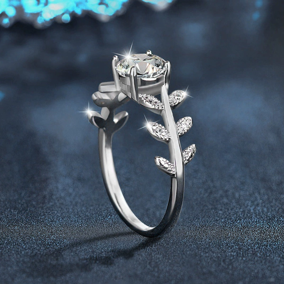 Leaf Vine Four-Prong Round Moissanite Engagement Ring with CZ close-up detail view with moissanite sparkle