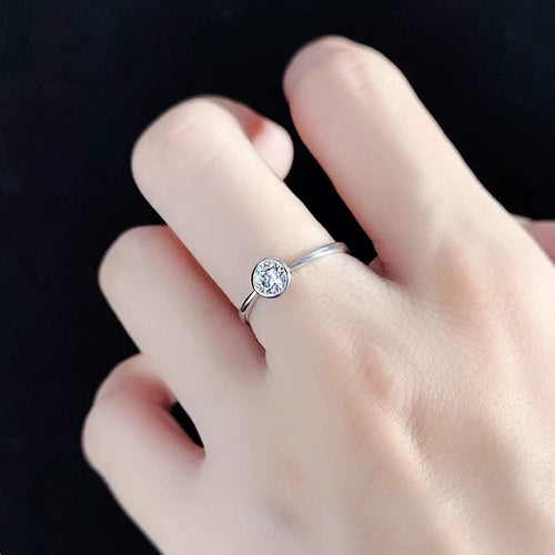 Bezel Round Moissanite Wedding Ring worn on hand to show scale, band width, and ring profile