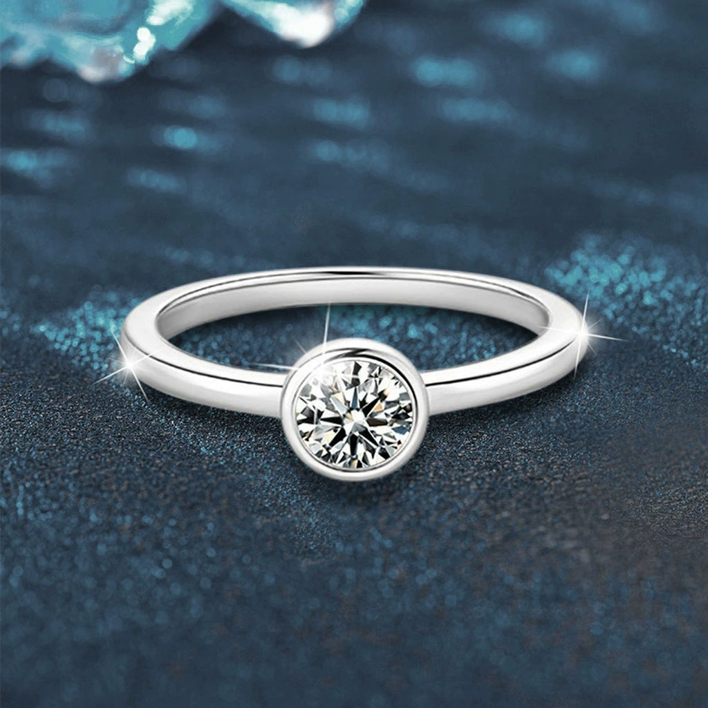 Bezel Round Moissanite Wedding Ring close-up detail view with moissanite sparkle