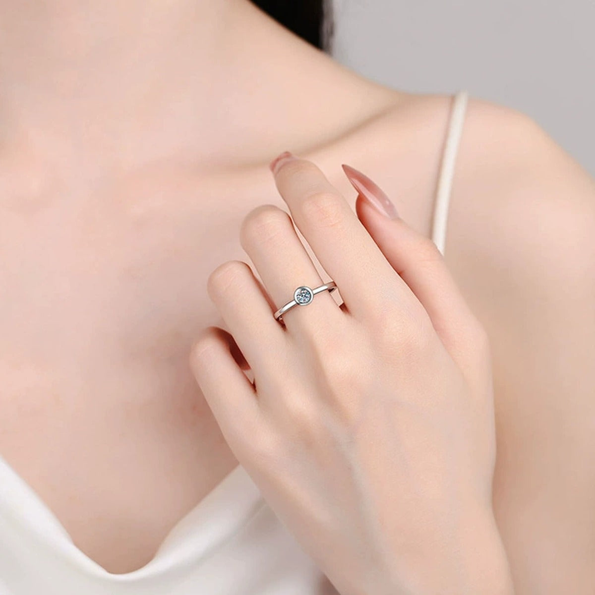 Bezel Round Moissanite Wedding Ring worn on hand to show scale, band width, and ring profile