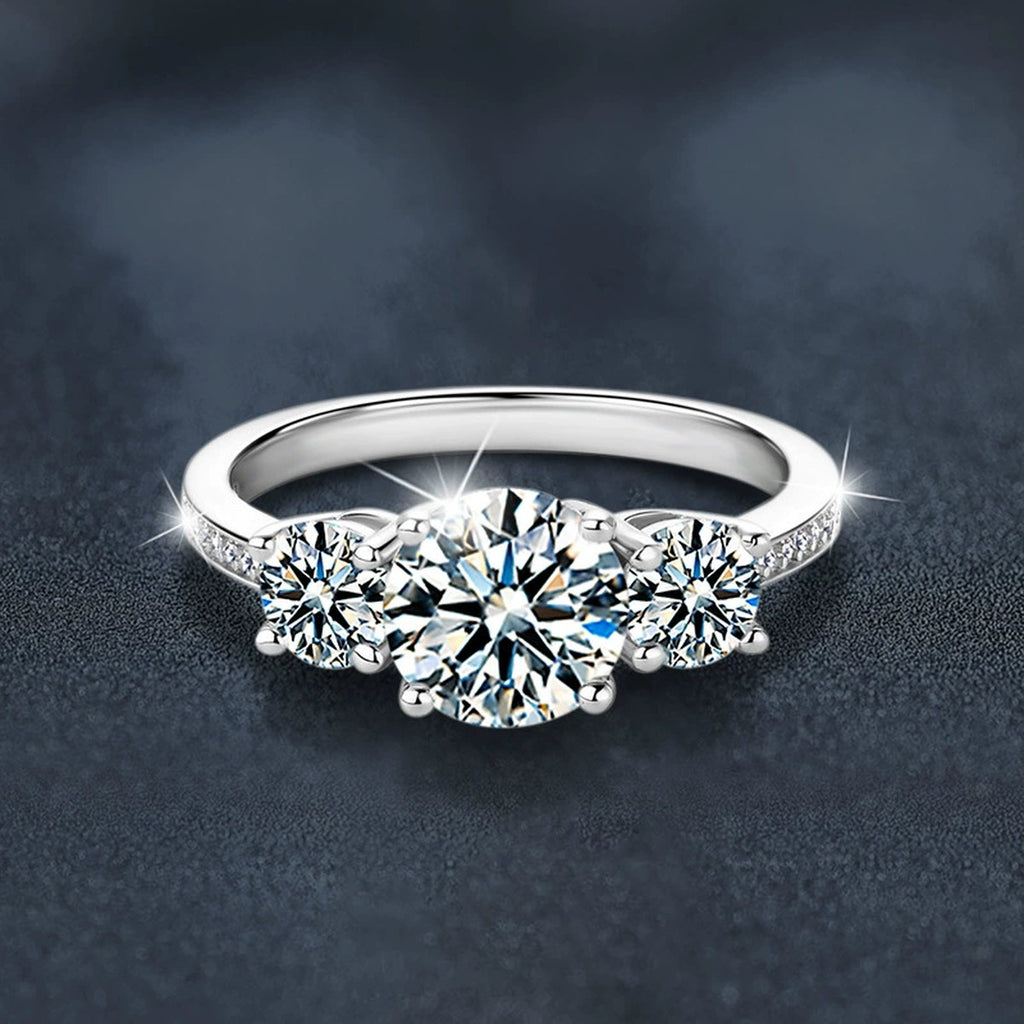 Graduated Round Moissanite Engagement Ring with CZ close-up detail view with moissanite sparkle