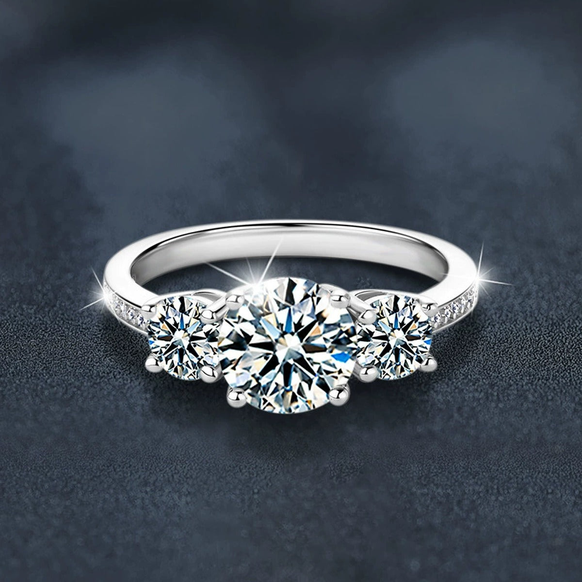 Graduated Round Moissanite Engagement Ring with CZ close-up detail view with moissanite sparkle