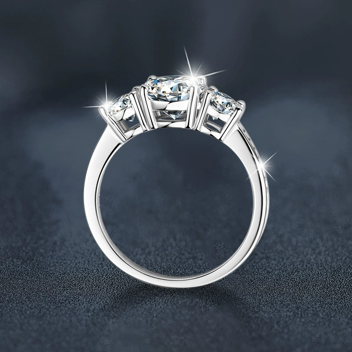 Graduated Round Moissanite Engagement Ring with CZ close-up detail view with moissanite sparkle