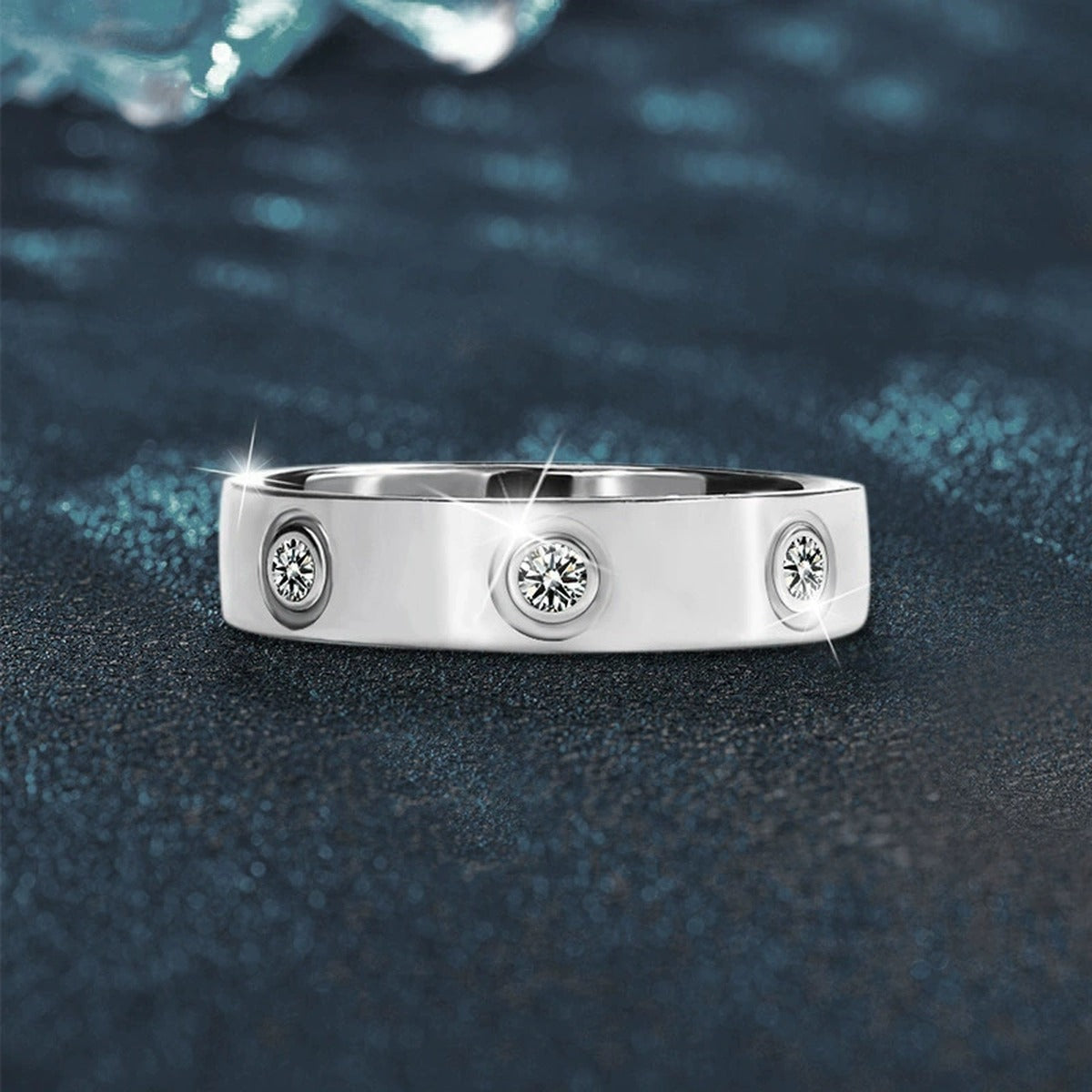 Bezel-Set Round Moissanite Wide Wedding Band close-up detail view with moissanite sparkle