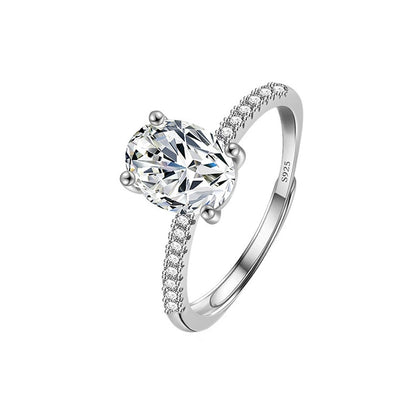 Four-Prong Oval Moissanite Engagement Ring with CZ in white gold-plated S925 sterling silver on clean white background