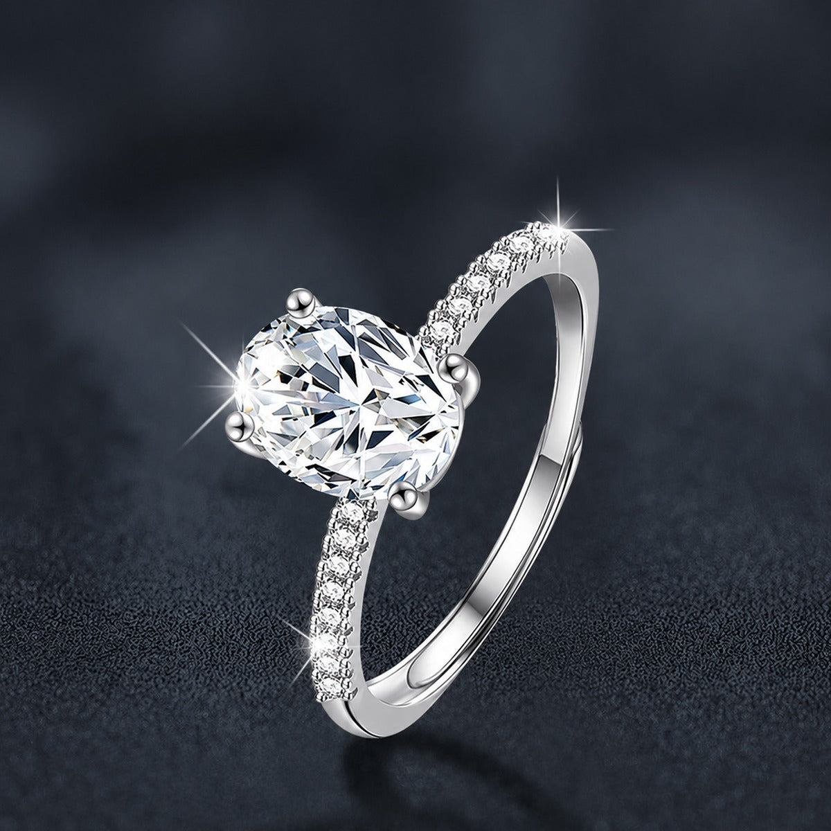 Four-Prong Oval Moissanite Engagement Ring with CZ close-up detail view with moissanite sparkle