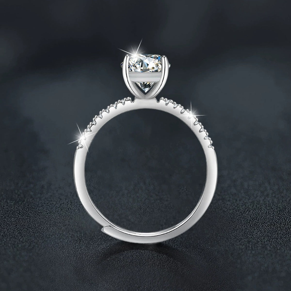 Four-Prong Oval Moissanite Engagement Ring with CZ close-up detail view with moissanite sparkle