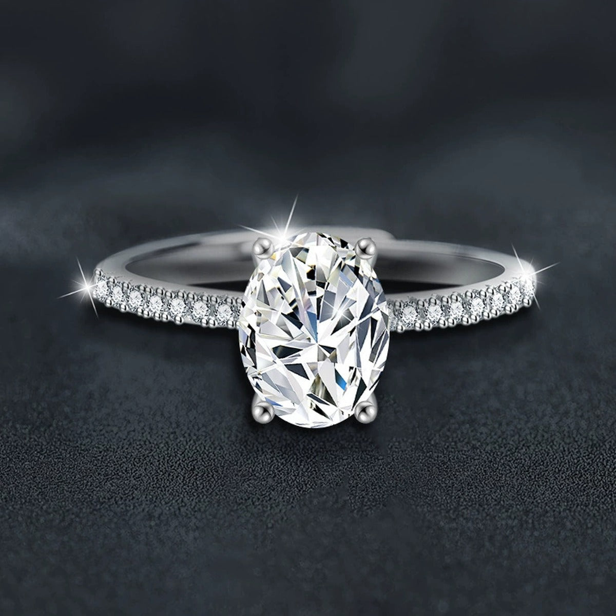 Four-Prong Oval Moissanite Engagement Ring with CZ close-up detail view with moissanite sparkle