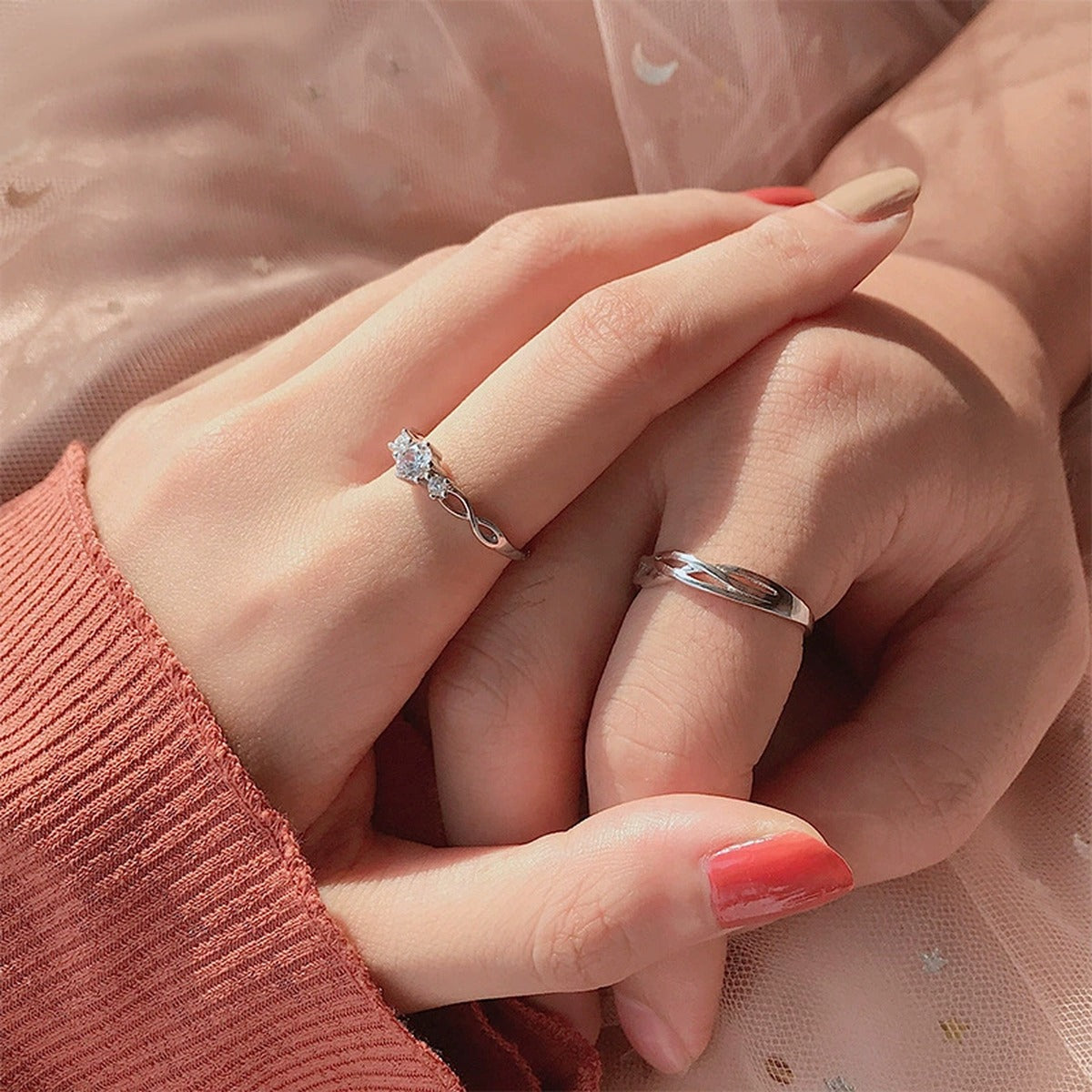 Interlaced Couples Adjustable Wedding Rings worn on hand to show scale, band width, and ring profile