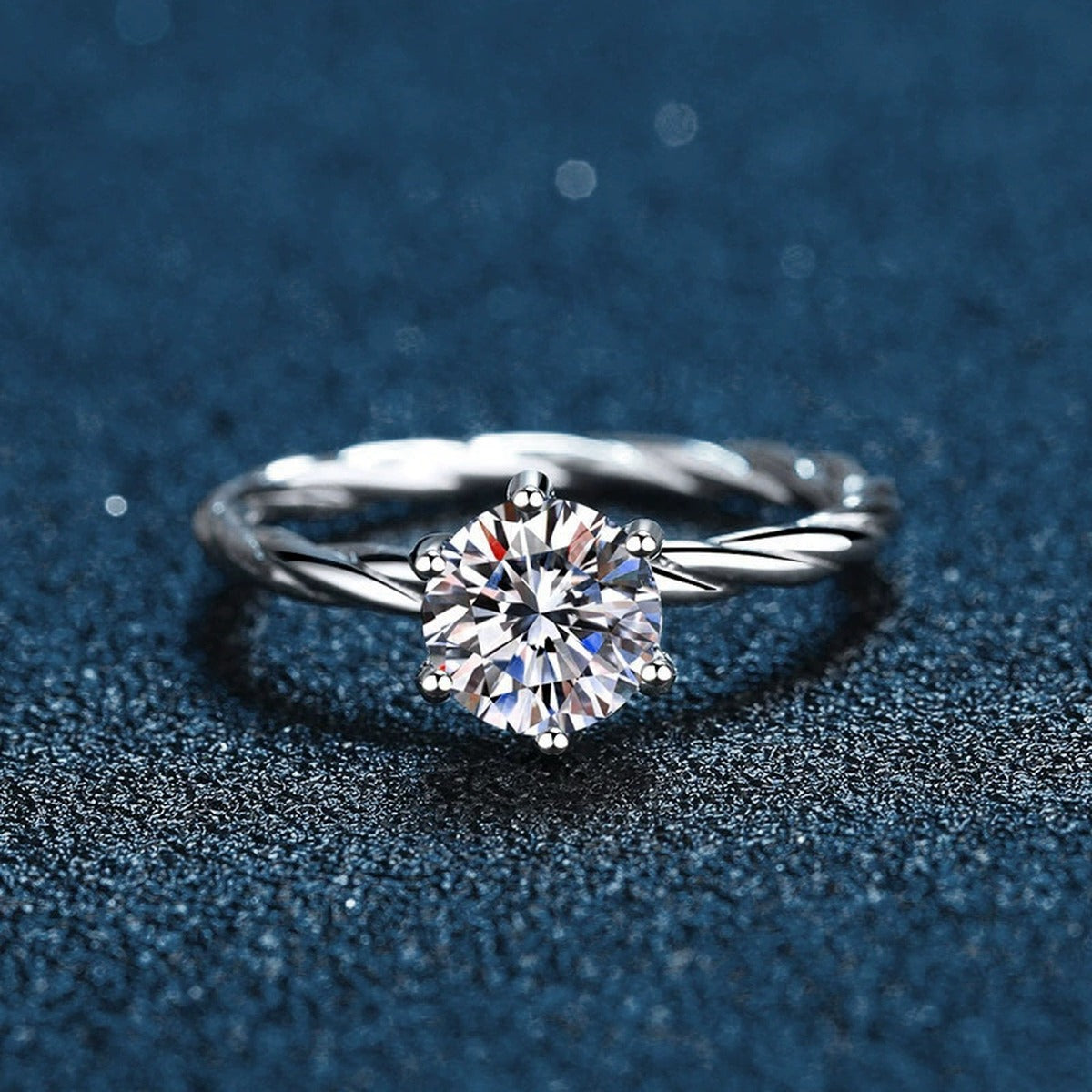 Six-Prong Round Moissanite Twist Engagement Ring close-up detail view with moissanite sparkle