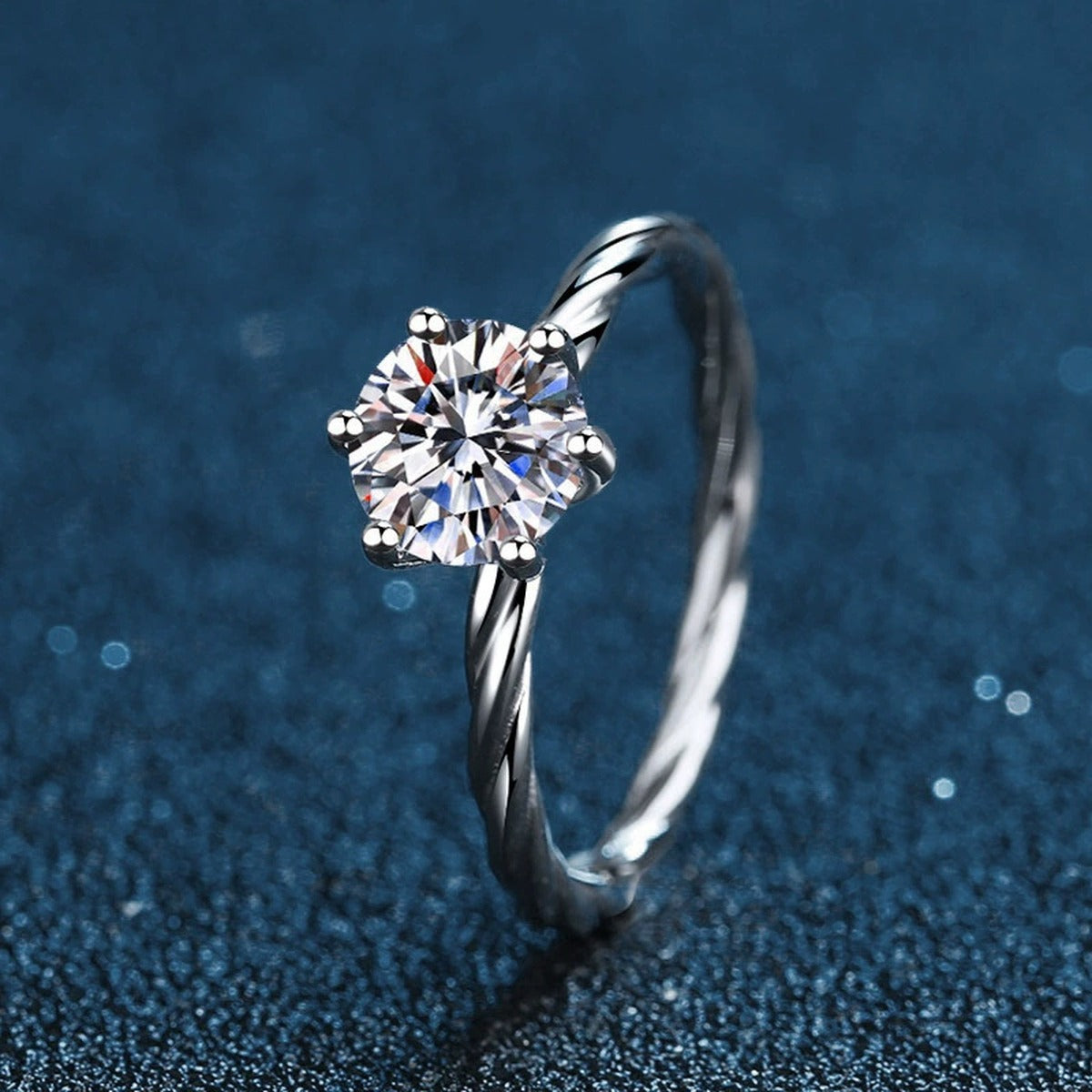 Six-Prong Round Moissanite Twist Engagement Ring close-up detail view with moissanite sparkle