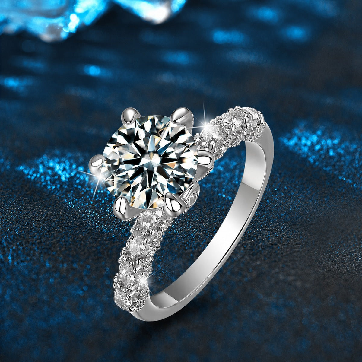 Six-Prong Round Moissanite Engagement Ring with CZ close-up detail view with moissanite sparkle