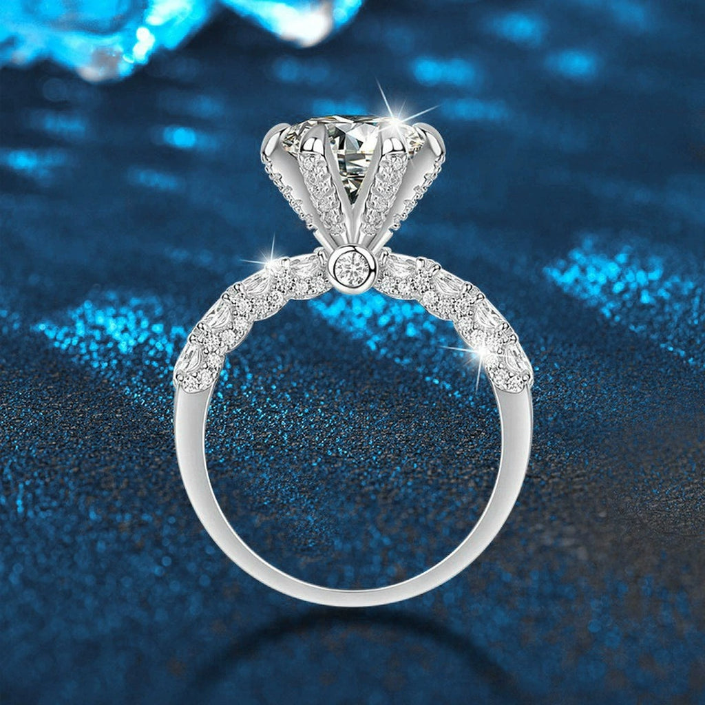 Six-Prong Round Moissanite Engagement Ring with CZ close-up detail view with moissanite sparkle