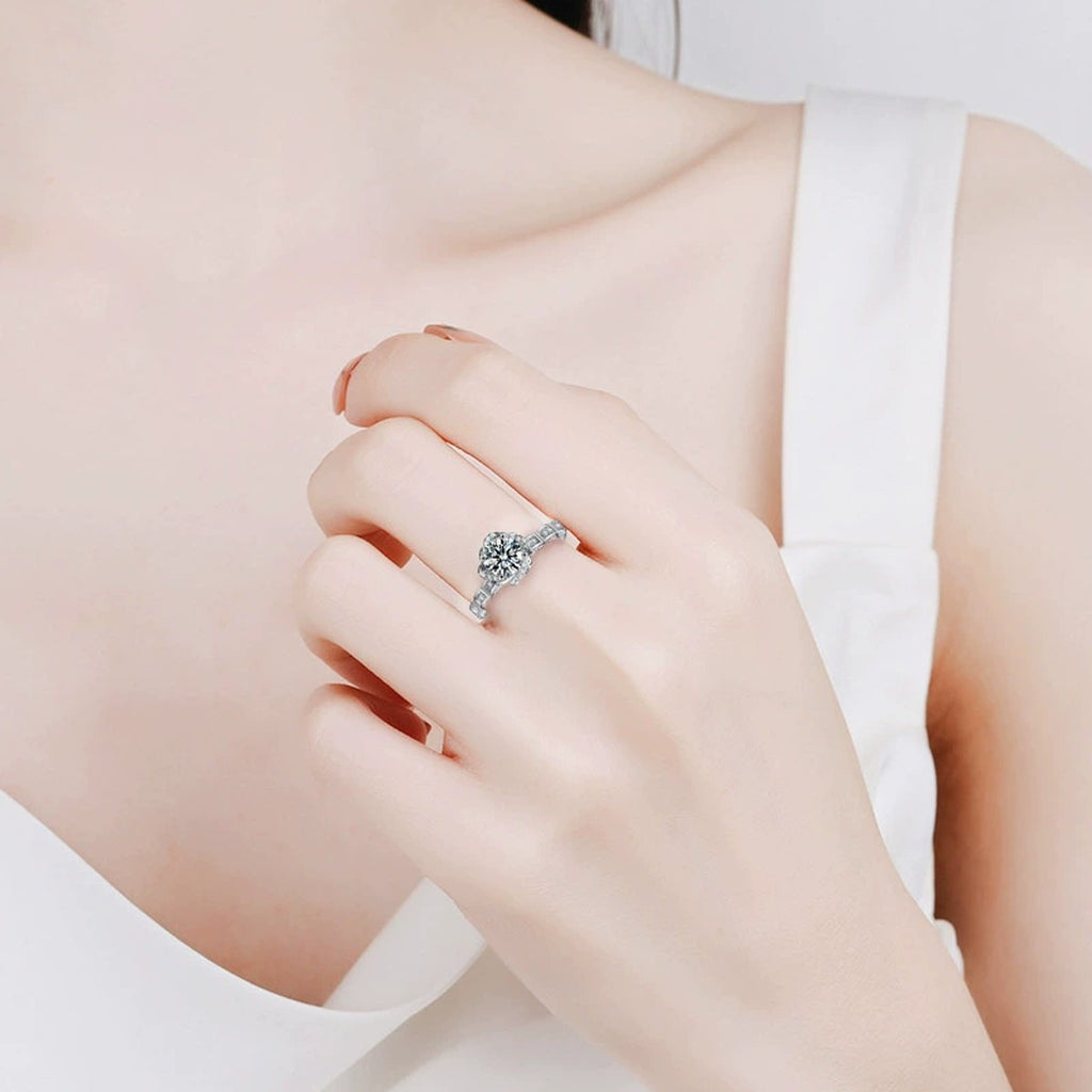 Rose Motif Round Moissanite Engagement Ring with CZ worn on hand to show scale, band width, and ring profile
