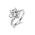 Six-Prong Round Moissanite Engagement Ring with CZ in white gold-plated S925 sterling silver on clean white background