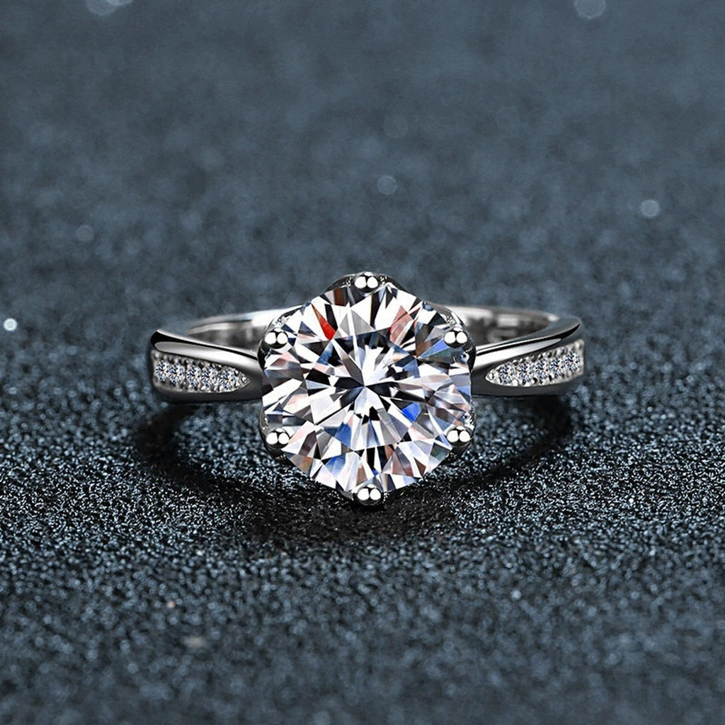 Six-Prong Round Moissanite Engagement Ring with CZ close-up detail view with moissanite sparkle