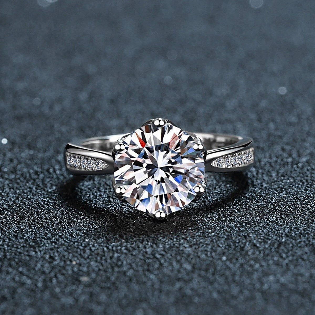 Six-Prong Round Moissanite Engagement Ring with CZ close-up detail view with moissanite sparkle