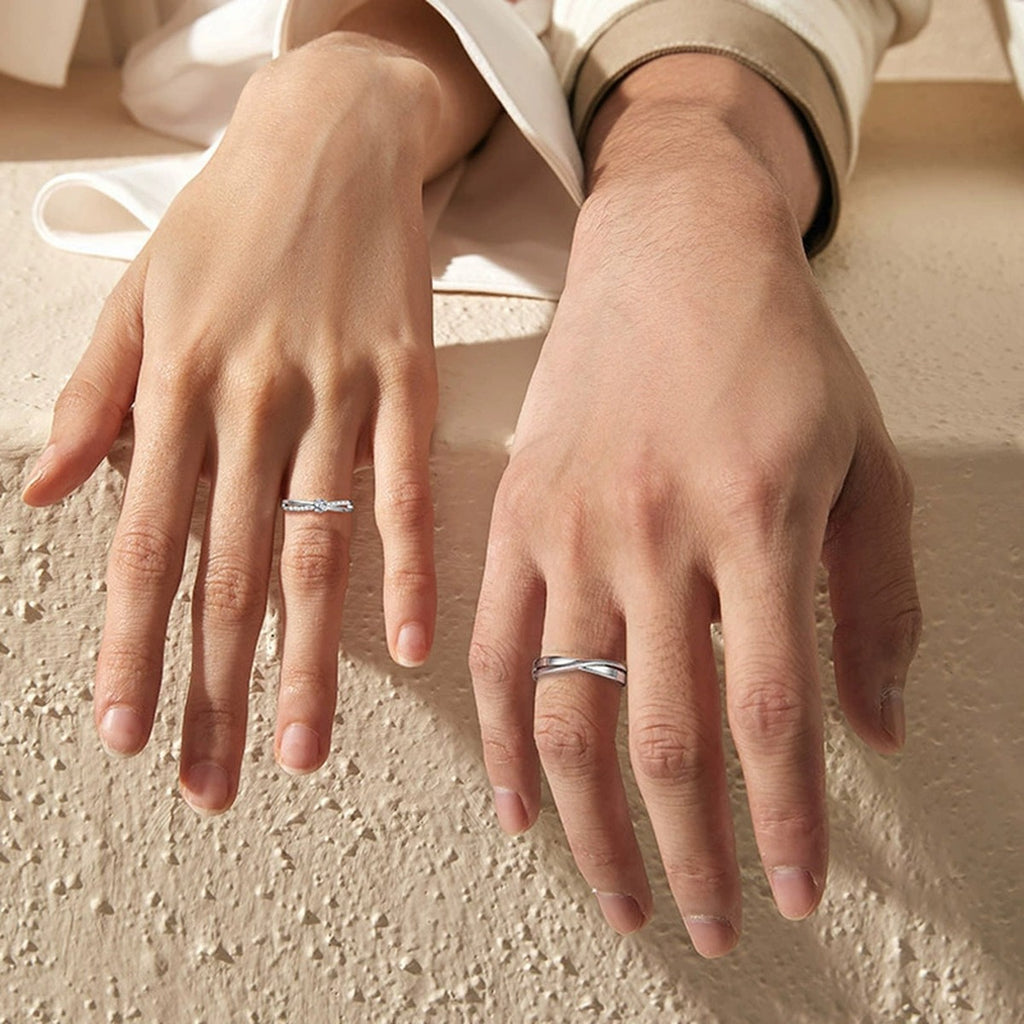 Round Moissanite Couples Wedding Rings worn on hand to show scale, band width, and ring profile