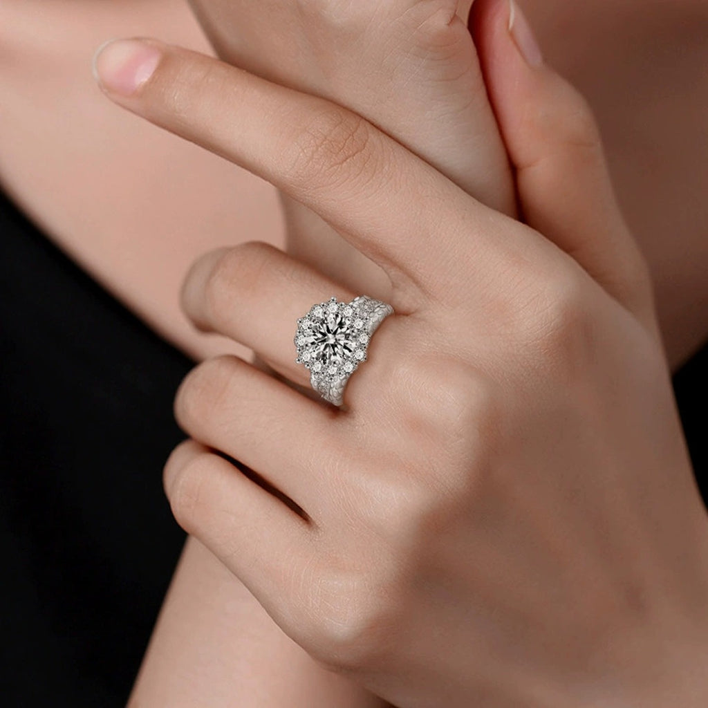 Sunflower Round Moissanite Engagement Ring with CZ worn on hand to show scale, band width, and ring profile