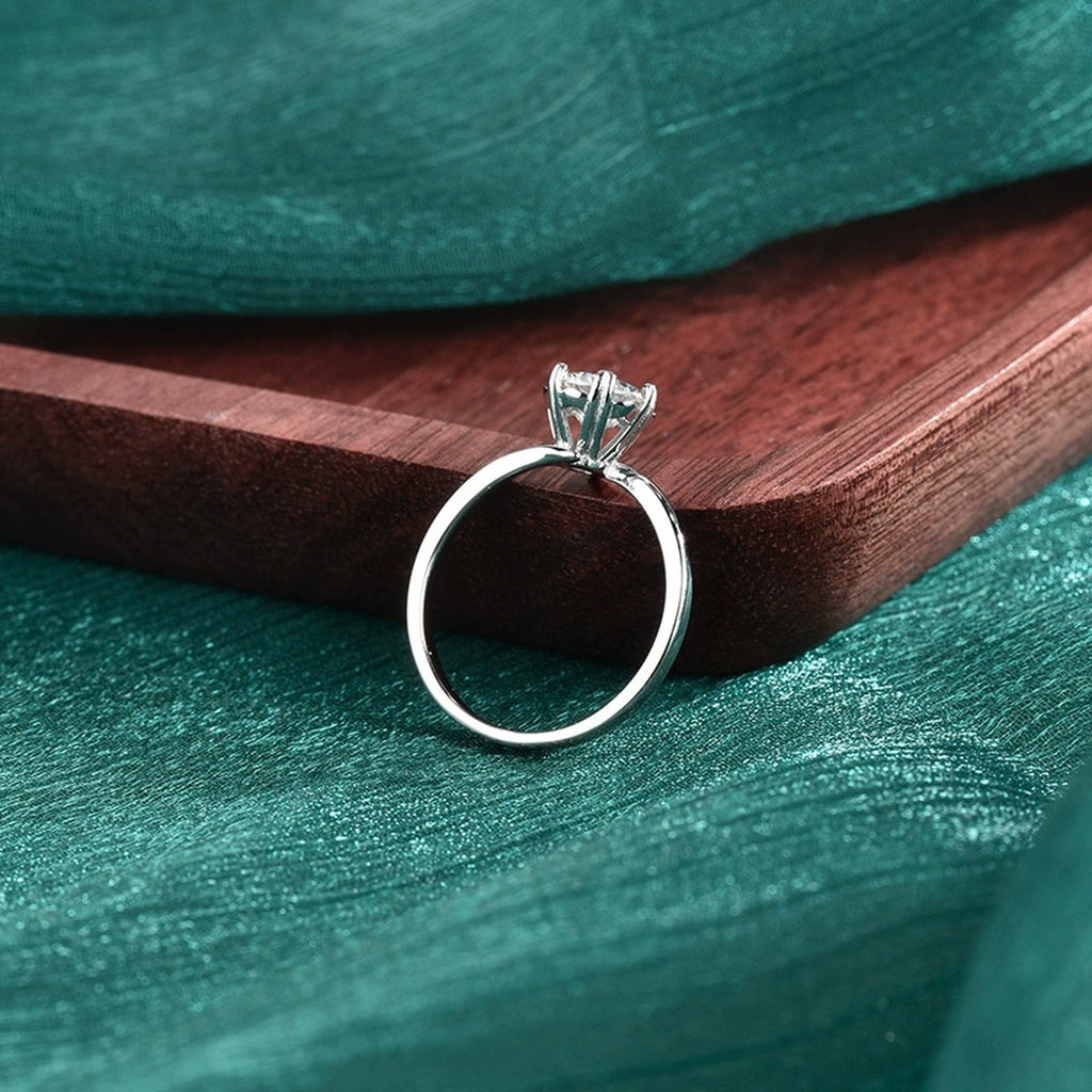 Six-Prong Round Moissanite Solitaire Engagement Ring close-up detail view with moissanite sparkle