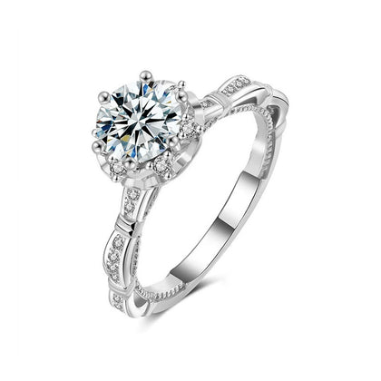 Vintage Six-Prong Round Moissanite Engagement Ring with CZ in white gold-plated S925 sterling silver on clean white background