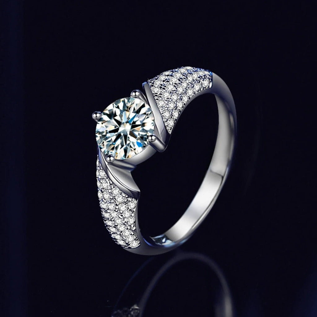 Four-Prong Round Moissanite Wedding Ring with CZ close-up detail view with moissanite sparkle