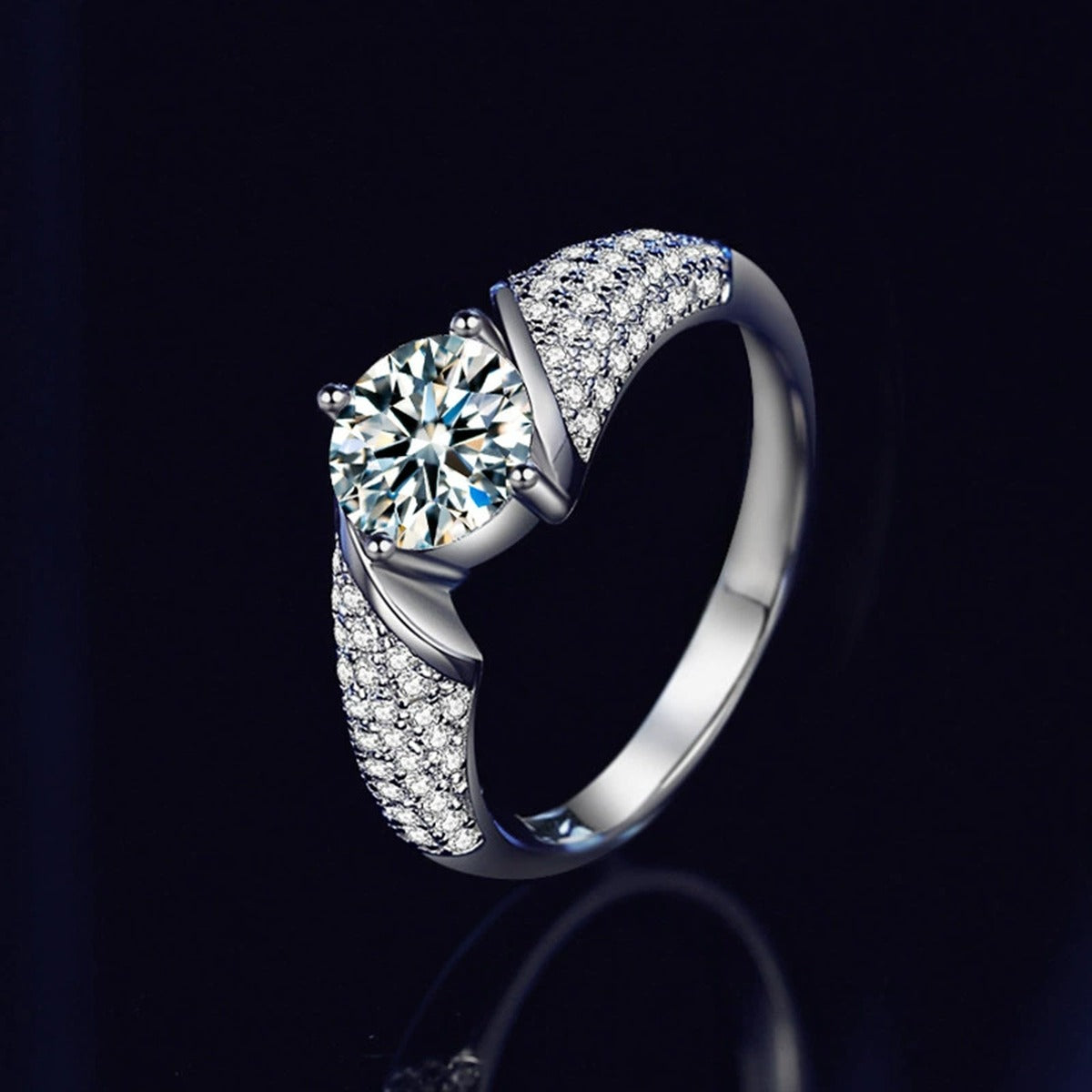 Four-Prong Round Moissanite Wedding Ring with CZ close-up detail view with moissanite sparkle