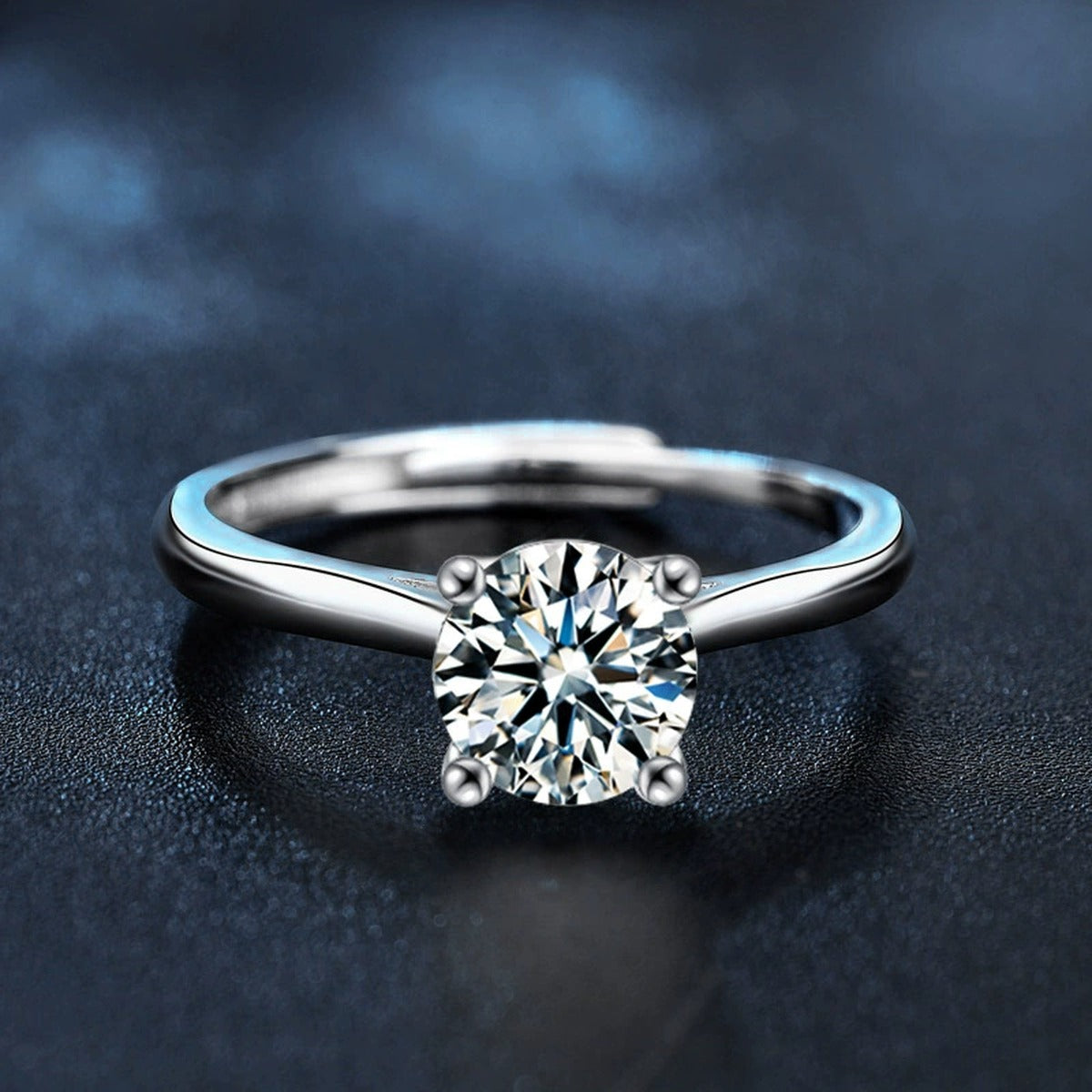 Four-Prong Round Moissanite Adjustable Solitaire Engagement Ring close-up detail view with moissanite sparkle