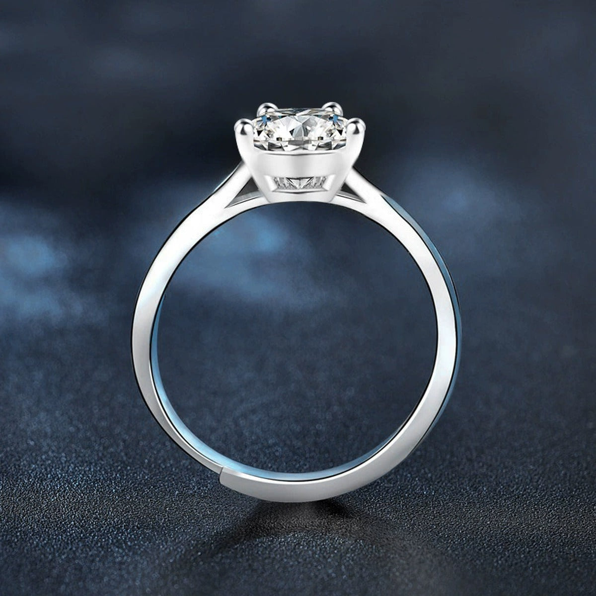 Four-Prong Round Moissanite Adjustable Solitaire Engagement Ring close-up detail view with moissanite sparkle