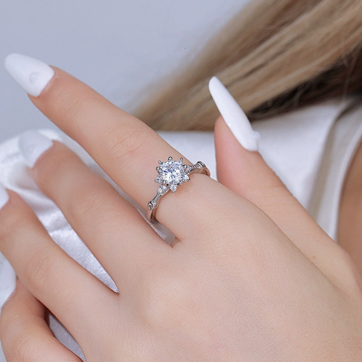 Compass Halo Round Moissanite Adjustable Engagement Ring with CZ worn on hand to show scale, band width, and ring profile