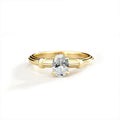Oval Cut Moissanite Solitaire Engagement Ring in Yellow Gold-Plated S925 Sterling Silver in gold-plated S925 sterling silver on clean white background