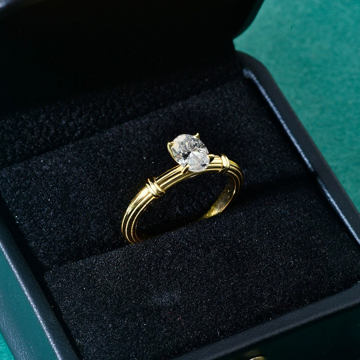 Oval Cut Moissanite Solitaire Engagement Ring in Yellow Gold-Plated S925 Sterling Silver close-up detail view with moissanite sparkle