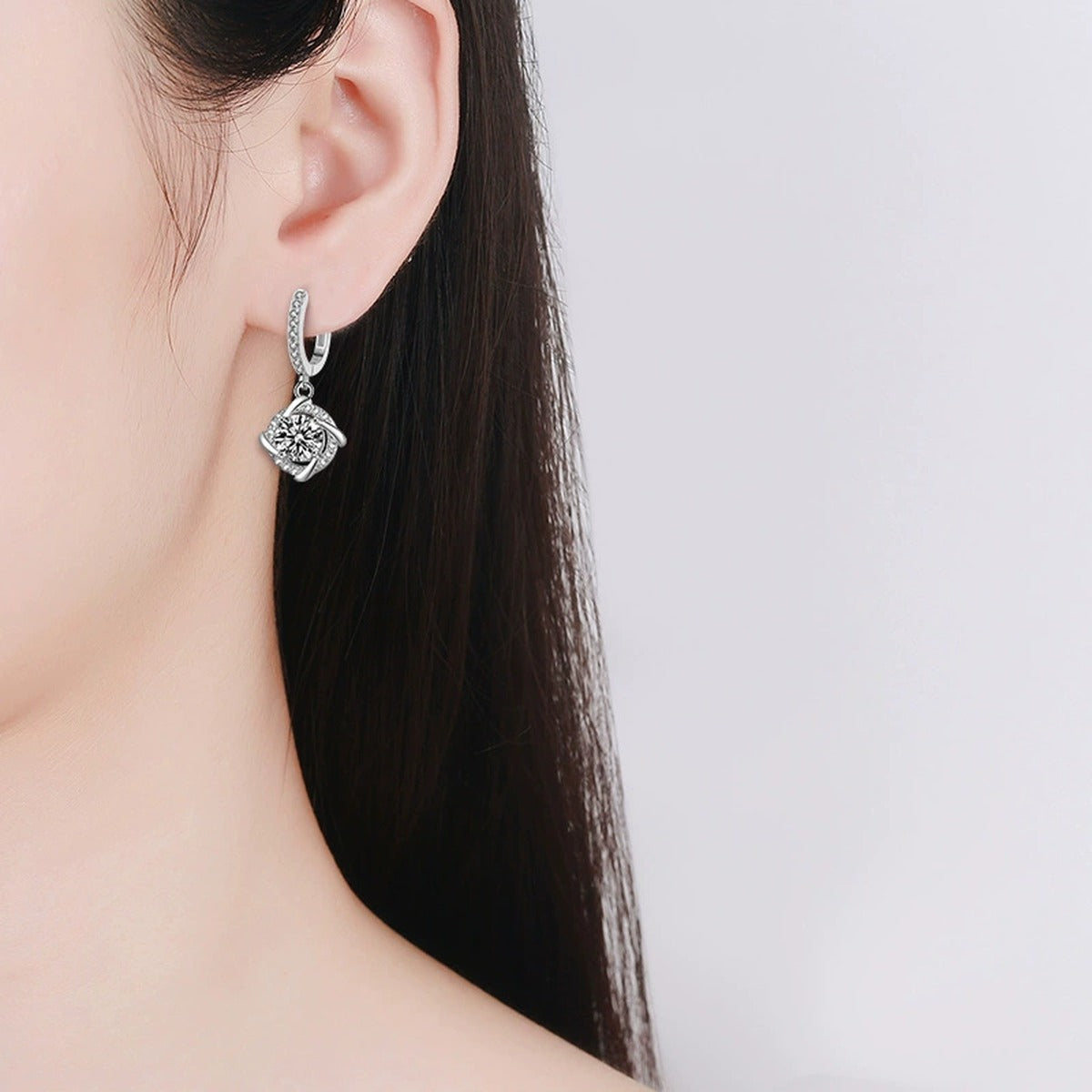 Cushion Halo Round Moissanite Hoop Dangle Earrings with CZ in White Gold-Plated S925 sterling silver worn on ear by model showing scale, placement, and hoop dangle earrings styling