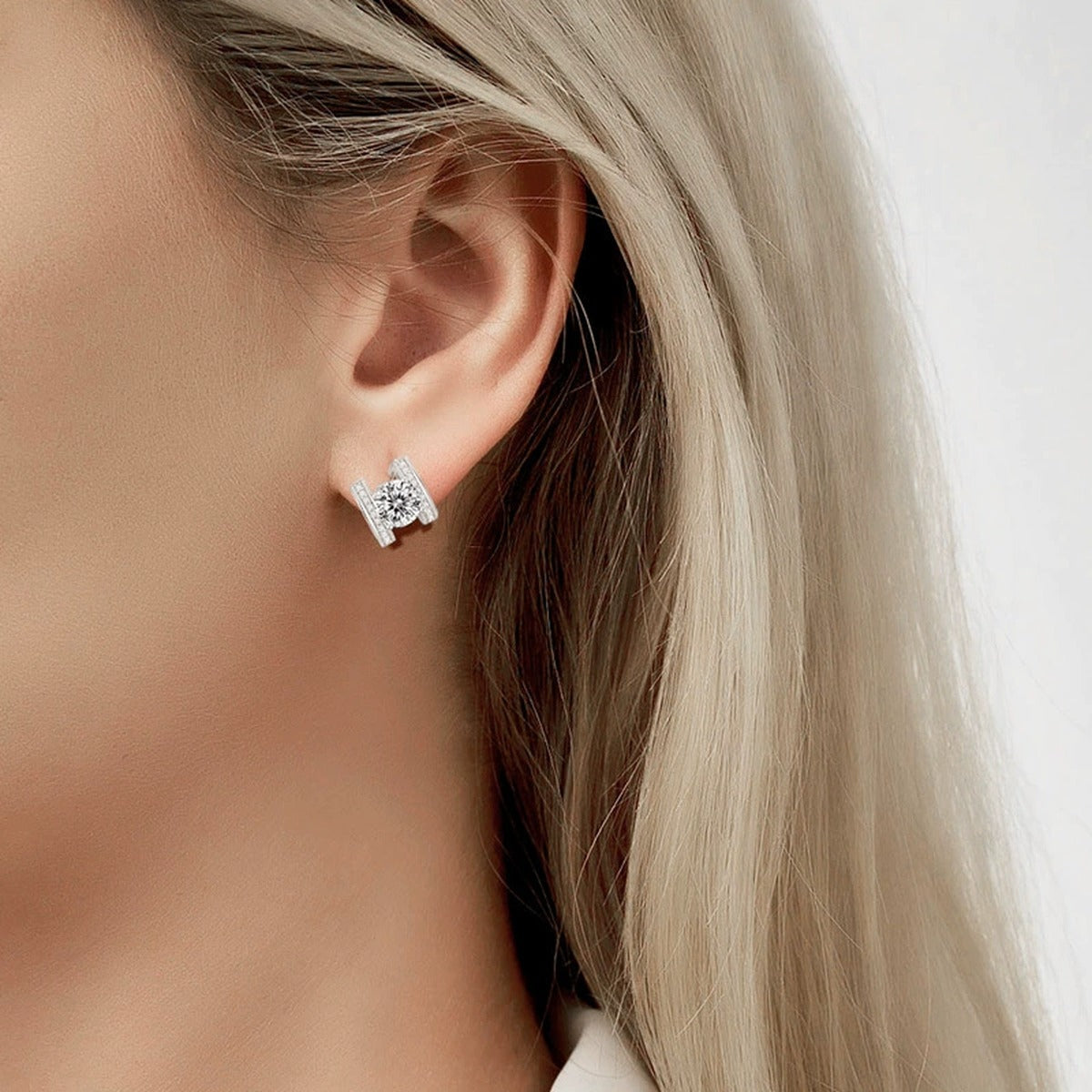 Bowknot Round Moissanite Huggie Hoop Earrings with CZ in Gold-Plated S925 sterling silver worn on ear by model showing scale, placement, and huggie hoop earrings styling