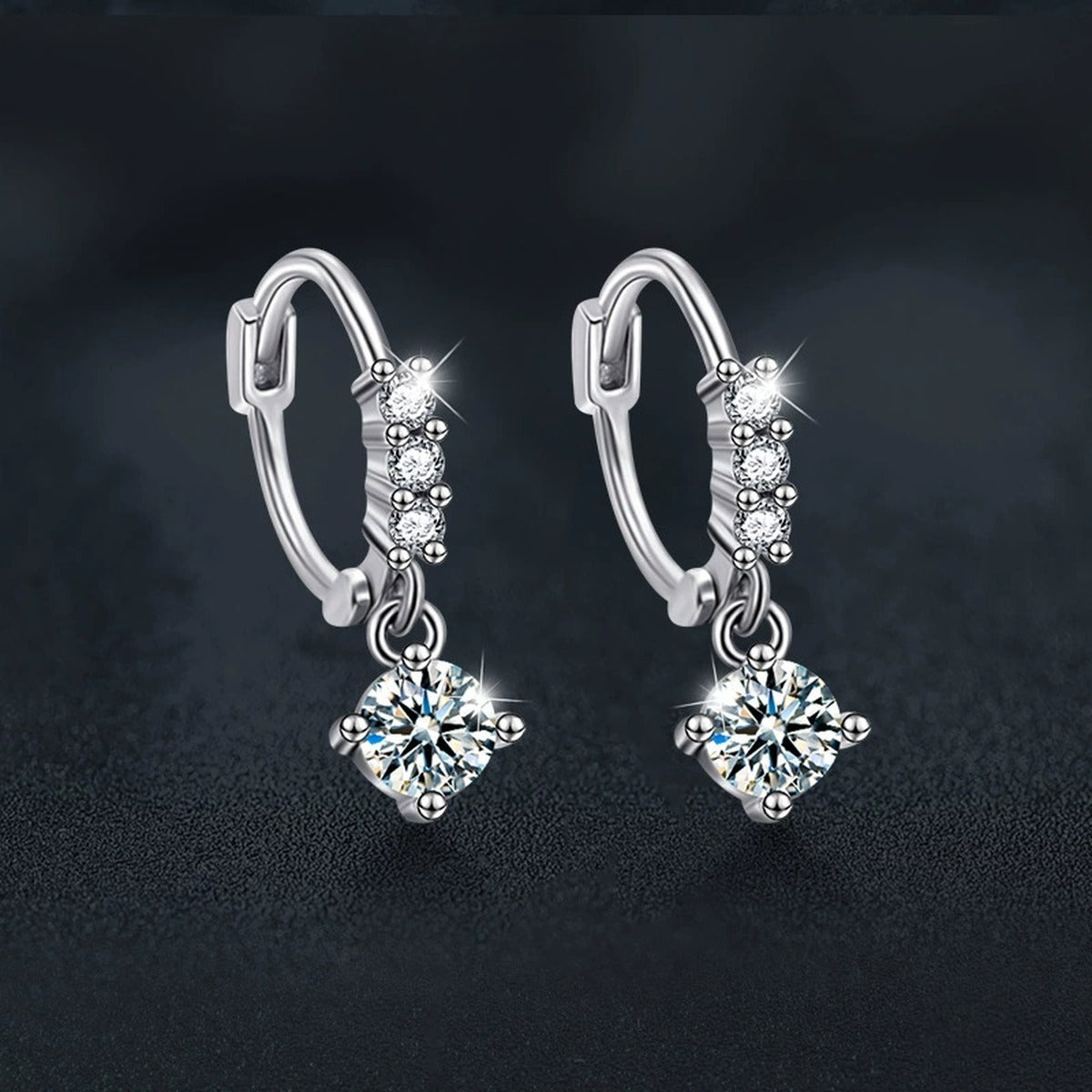 Graduated Round Moissanite Hoop Dangle Earrings with CZ in White Gold-Plated S925 sterling silver product scene view showing angled setting detail