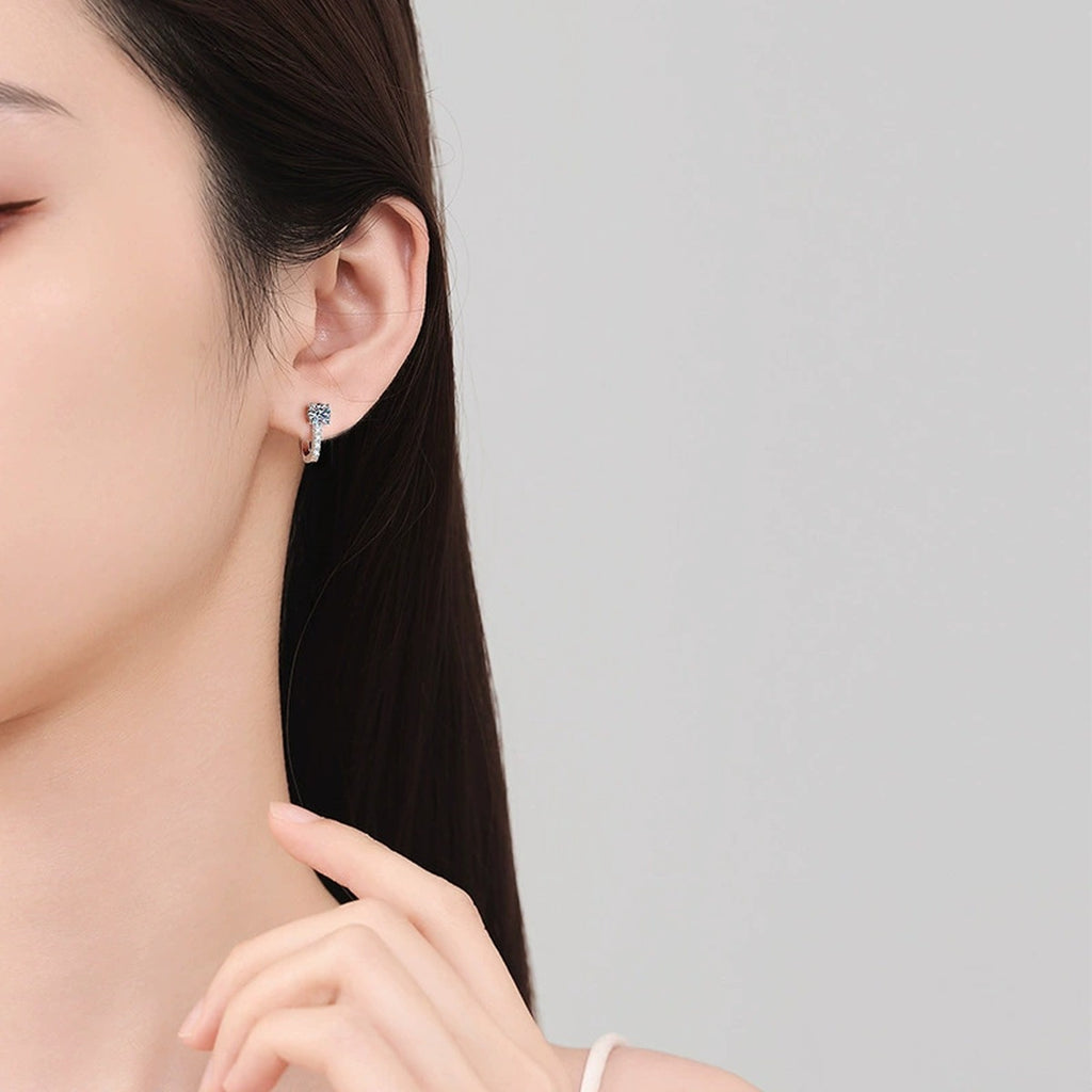 Round Moissanite Pavé Huggie Hoop Earrings with CZ in Gold-Plated S925 sterling silver worn on ear by model showing scale, placement, and huggie hoop earrings styling