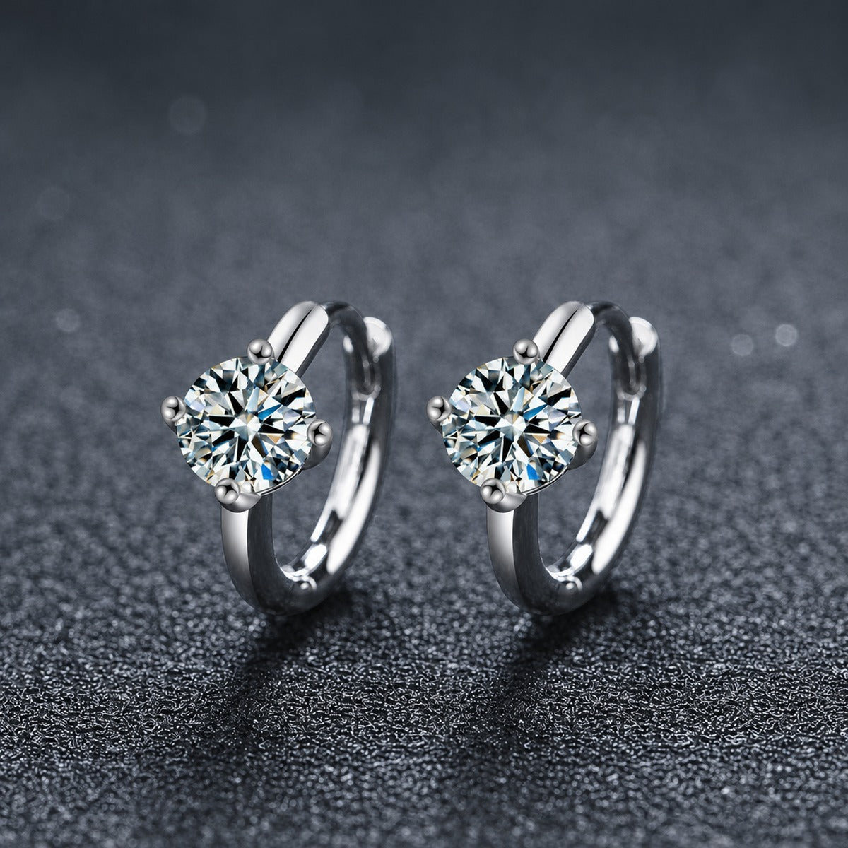 Four-Prong Round Moissanite Huggie Hoop Earrings in Gold-Plated S925 sterling silver product scene view showing angled setting detail