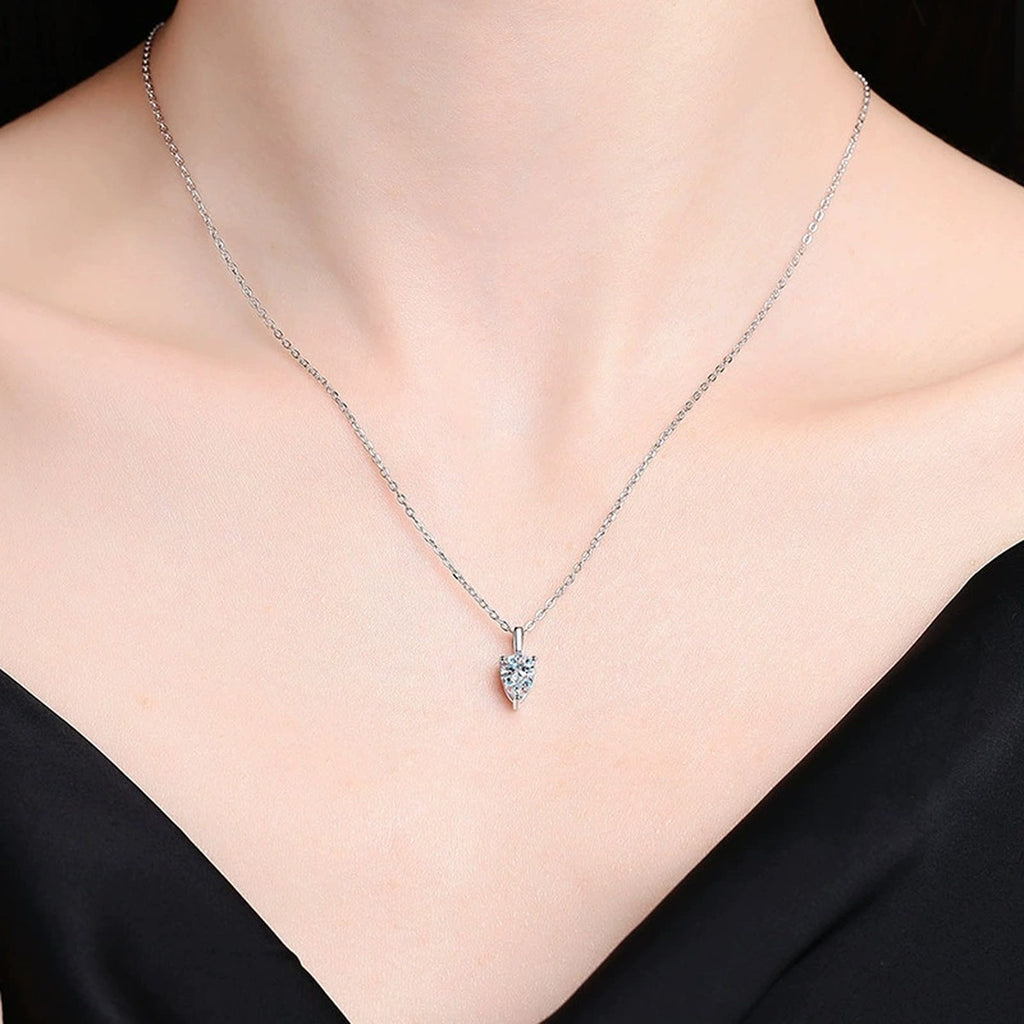 Model wearing a platinum-plated S925 sterling silver pear moissanite pendant necklace