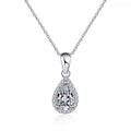 pear moissanite halo pendant necklace on white background