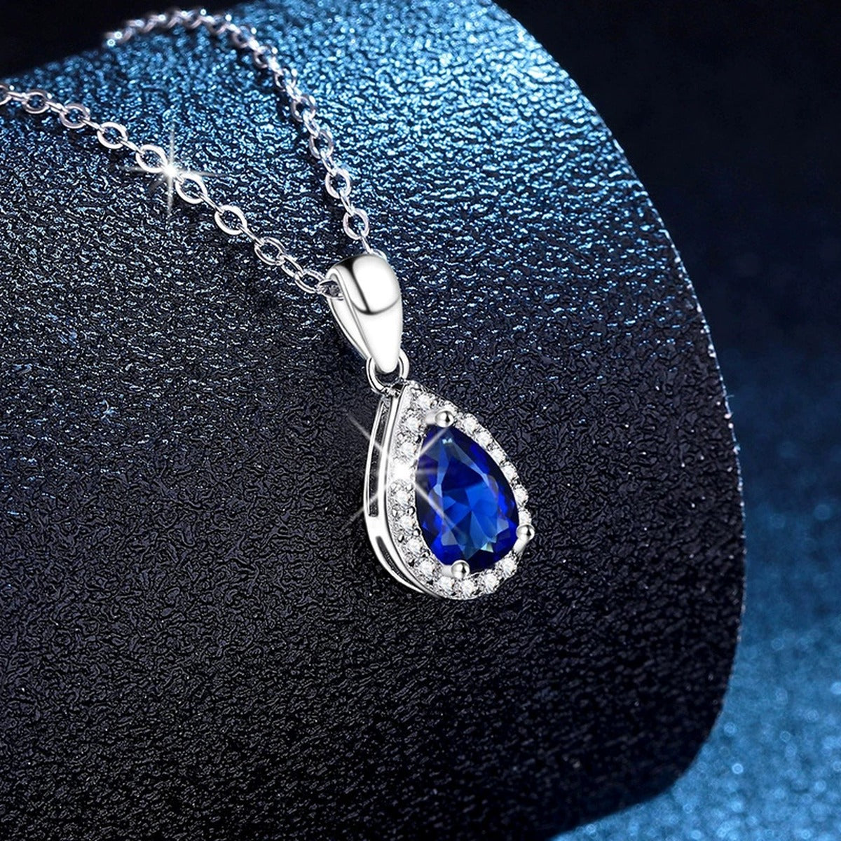 Oval Lab-Grown Gemstone and Moissanite Pendant Necklace in White Gold-Plated S925 Sterling Silver blue background product view